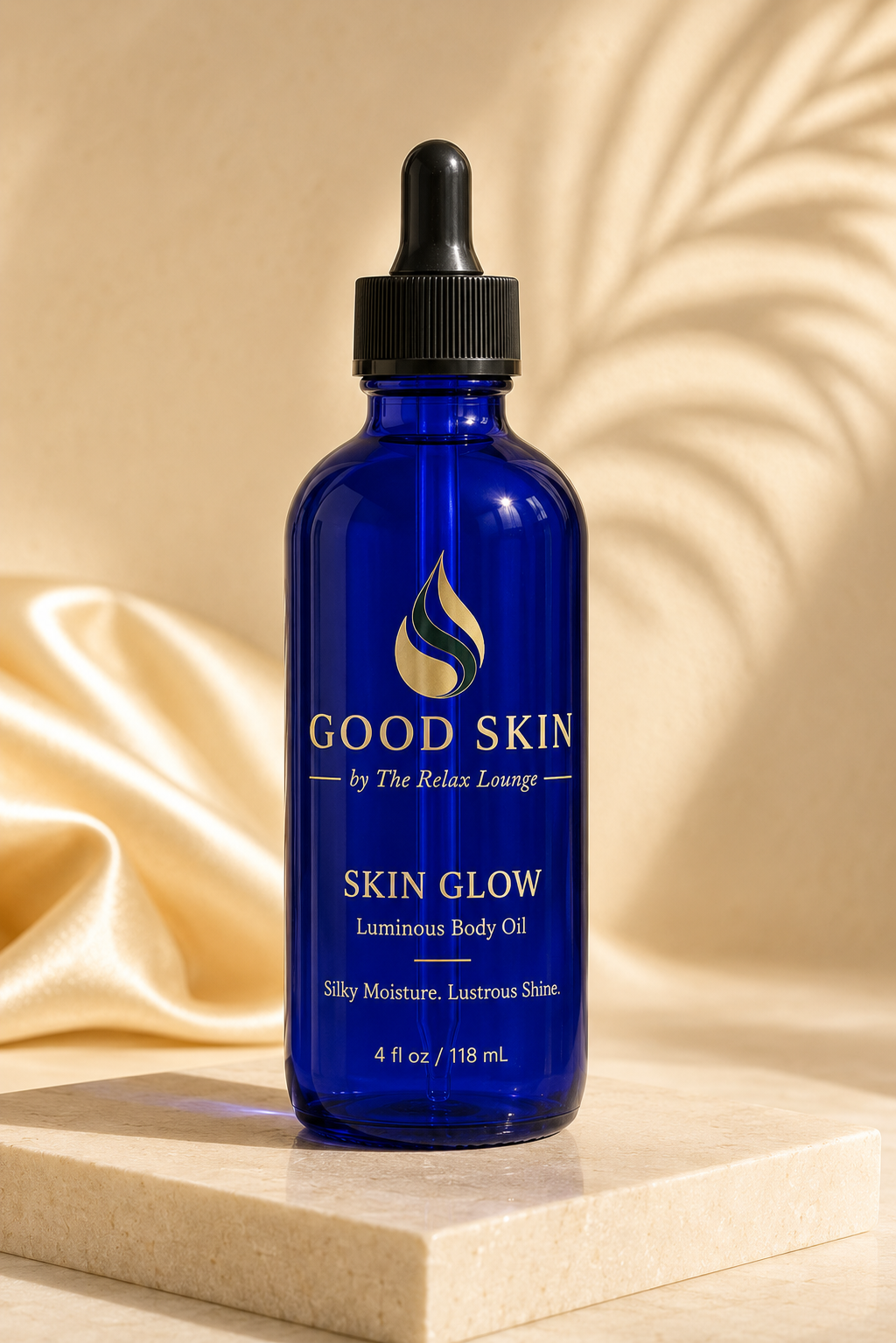 Good Skin Skin Glow luminous body oil in a four-ounce cobalt-blue glass dropper bottle.